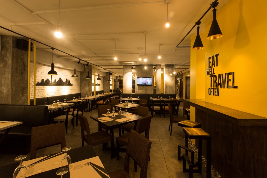 Dining spaces and the second massive yellow wall. Image Courtesy: Maruf Raihan